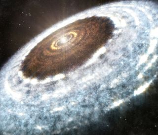 An artist's illustration shows the water snow line spotted around the young star V883 Orionis. In a new study, researchers have discovered ice fossils in an ancient meteorite which shows how objects that formed with ice beyond the snow line in the early solar system moved towards the sun (leaving behind these porous "fossils").