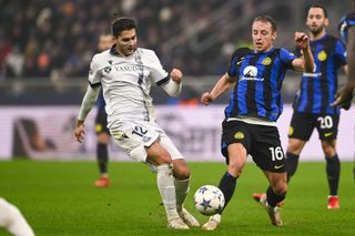 Arsen Zakharayan of Real Sociedad and Davide Frattesi of Inter Milan challenge for the ball during the UEFA Champions League group match at San Siro, Milan in December 2023