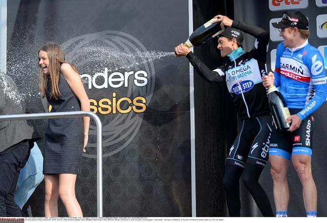 Naughty Niki Terpstra sprays the podium hostess with champagne