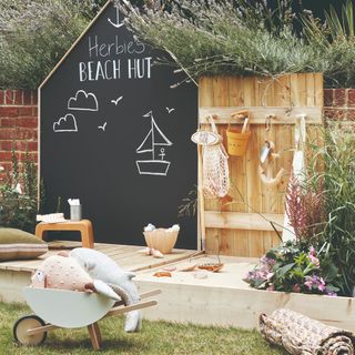 garden area with chalkboard and toys