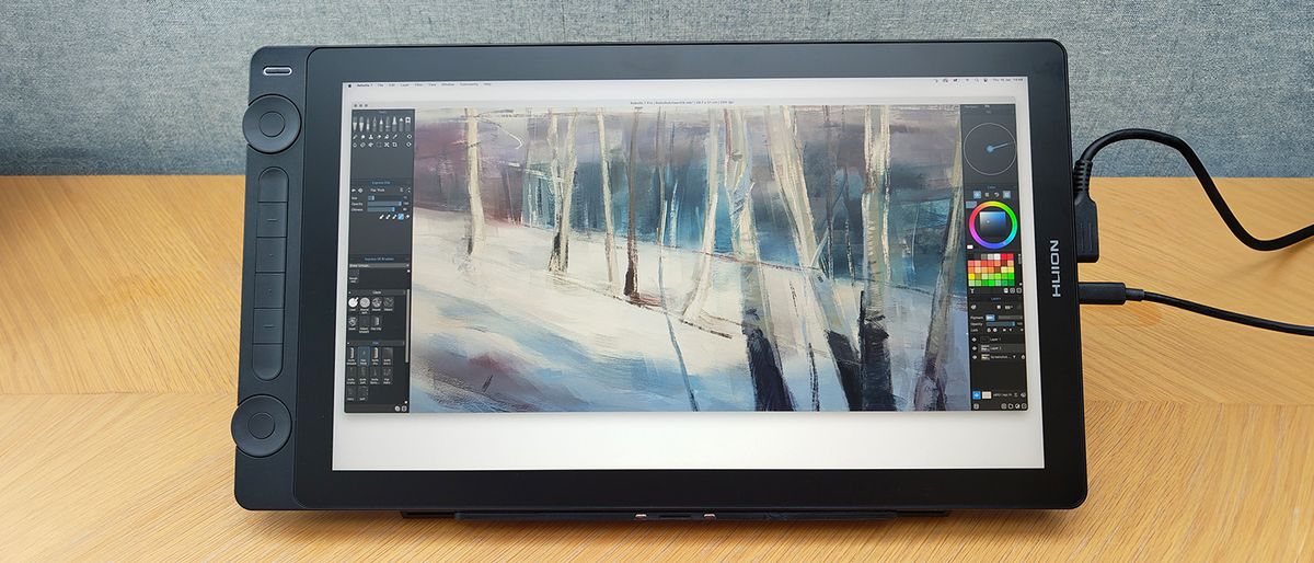 Huion Kamvas 16 (Gen 3) review; a drawing pen display on a wooden table