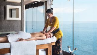 A woman getting a massage on board a cruise ship