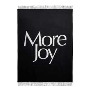 black throw blanket with 'more joy' on front