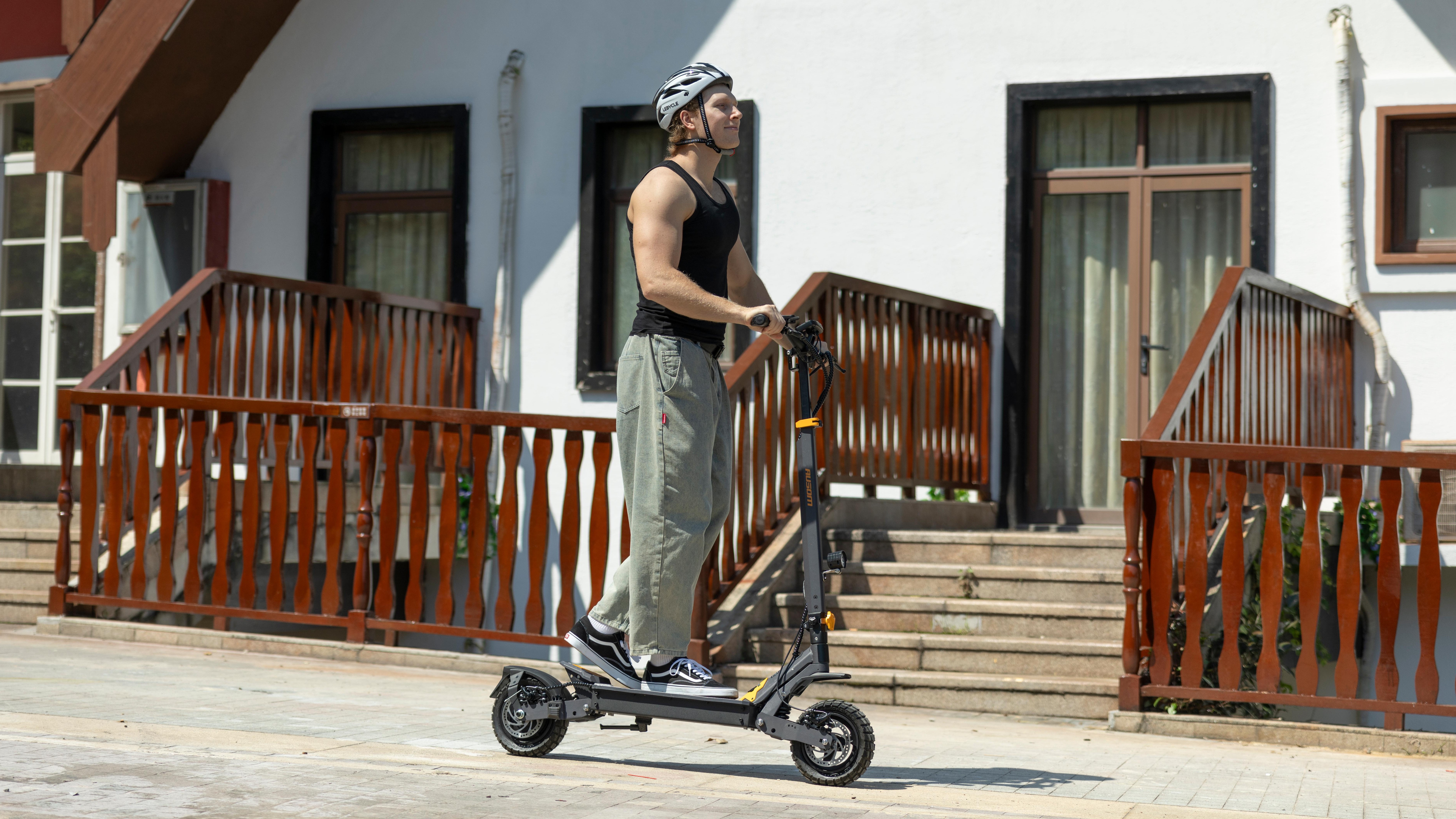 A lifestyle shot of a rider using the Ausom L1 electric scooter