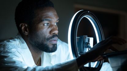 Simon Williams preparing to record an audition tape in front of a ring light in Wonder Man