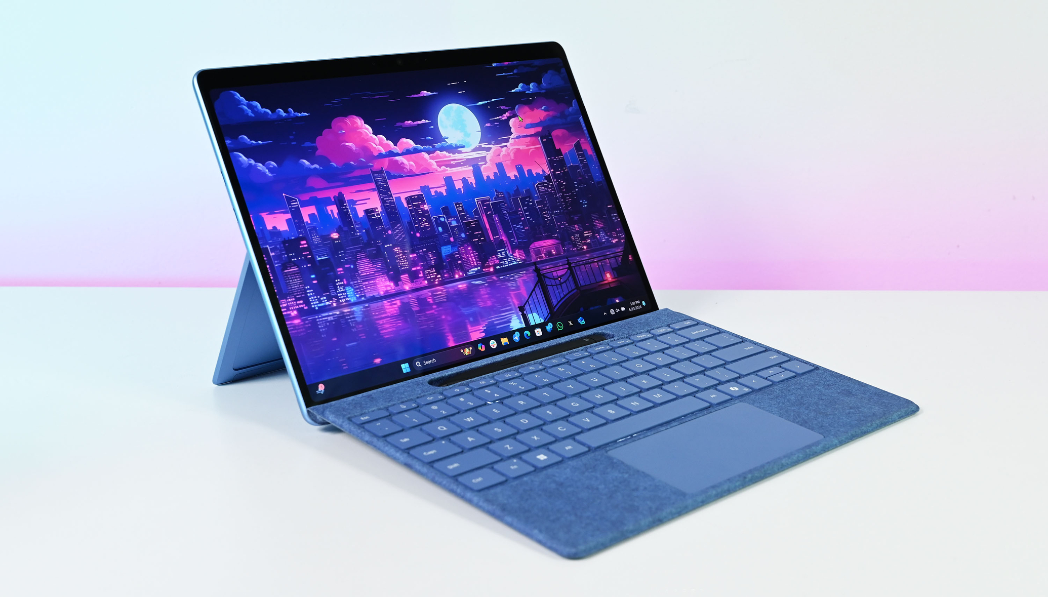 Microsoft Surface Pro 11 on desk with keyboard folio and Surface Pen