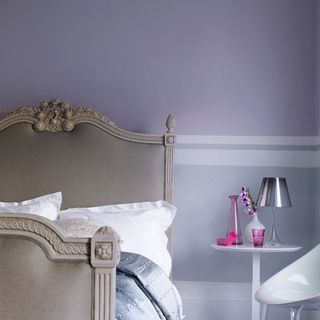 lilac bedroom with neutral upholstered bed