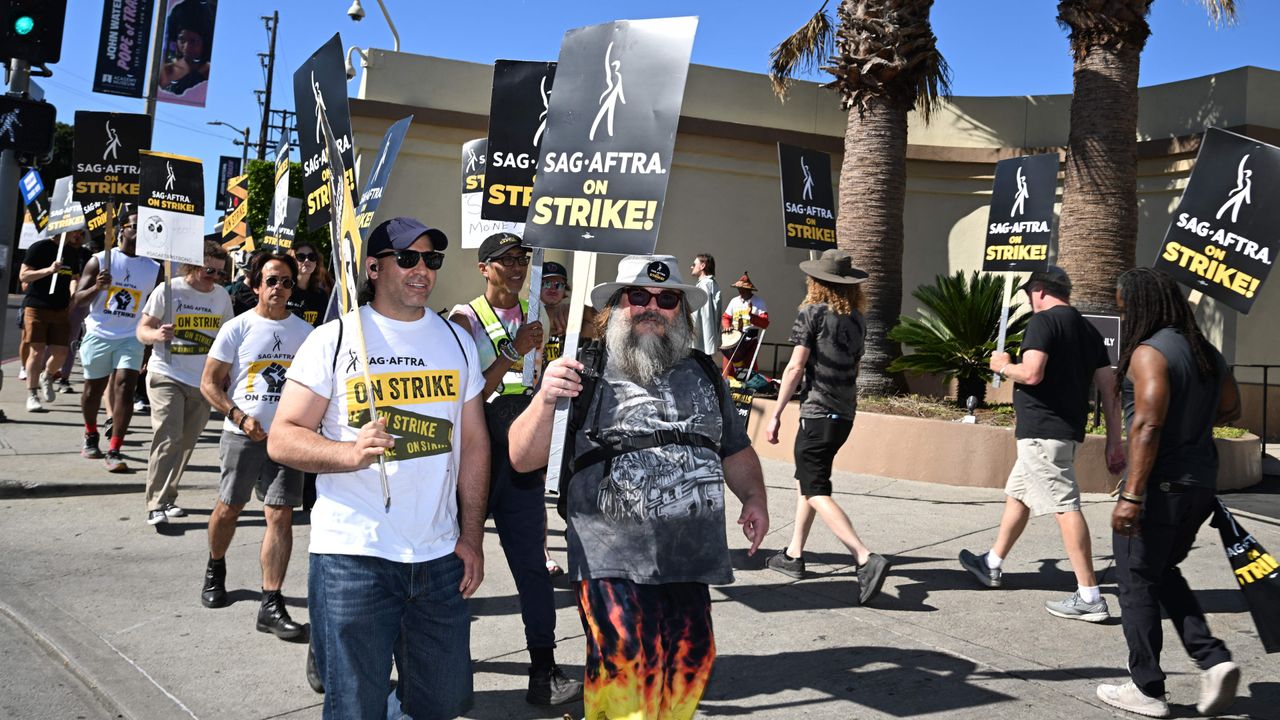 Juan Rodriguez and Jack Black on a SAG-AFTRA picket line