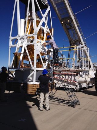 Technicians perform final checks on gondola-carried scientific gear used for NASA’s Balloon Rapid Response for ISON, a mission to observe Comet ISON from a high-altitude balloon, just before its launch from Fort Sumner, N.M., on Sept. 28, 2013.