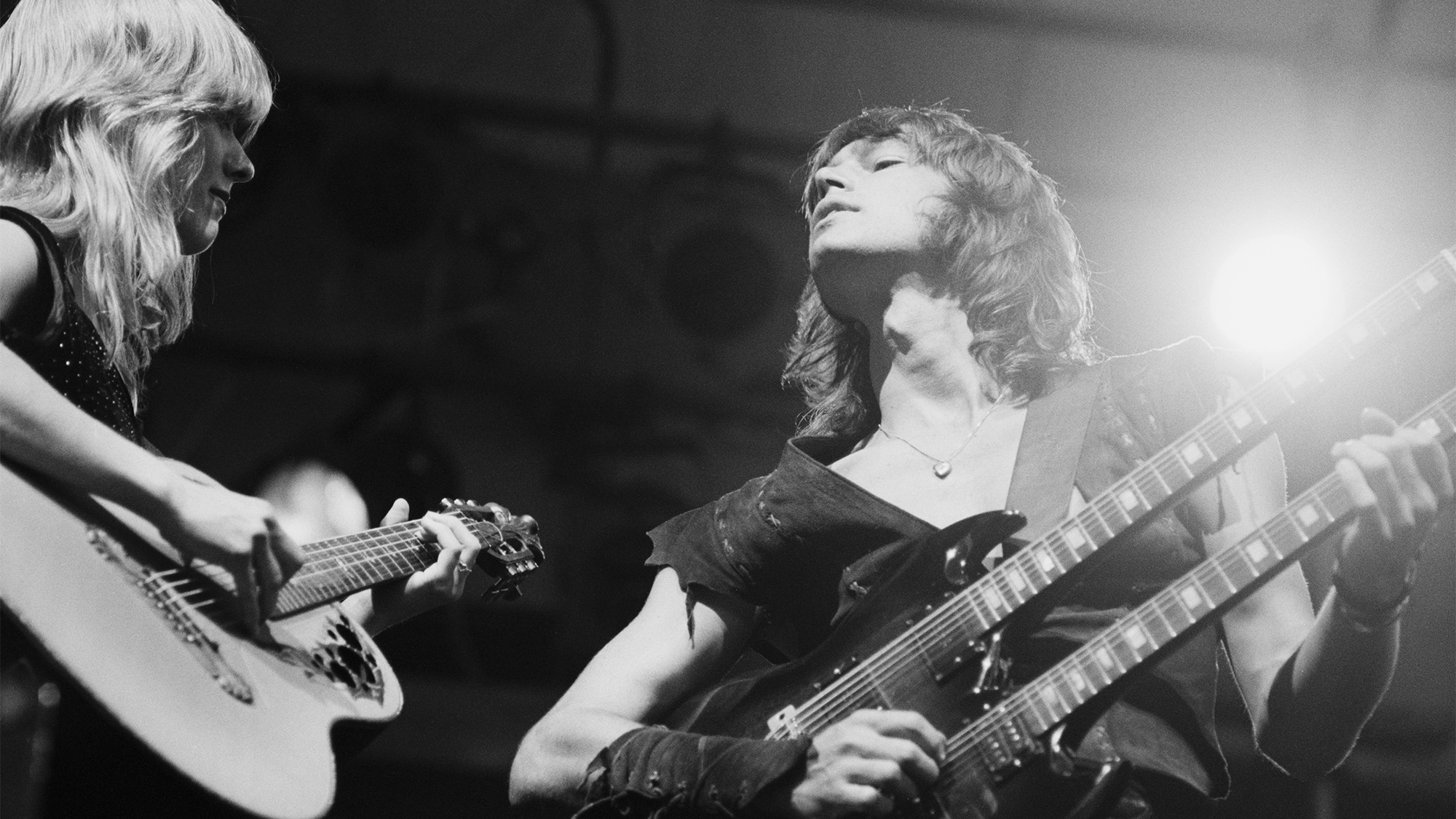 Singer-songwriters and guitarists Nancy Wilson (left) and her sister Ann Wilson, performing with American hard rock band Heart, at Portland Memorial Coliseum, Portland, Oregon, 24th August 1977.