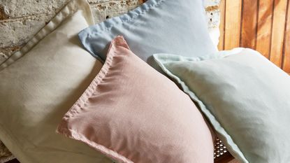 A pile of pastel colored pillows