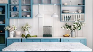 Blue kitchen with marble countertop
