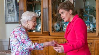 Britain's Queen Elizabeth II (L) greets Scotland's First Minister and leader of the Scottish National Party (SNP), Nicola Sturgeon, during an audience at the Palace of Holyroodhouse in Edinburgh, Scotland, on June 29, 2022.