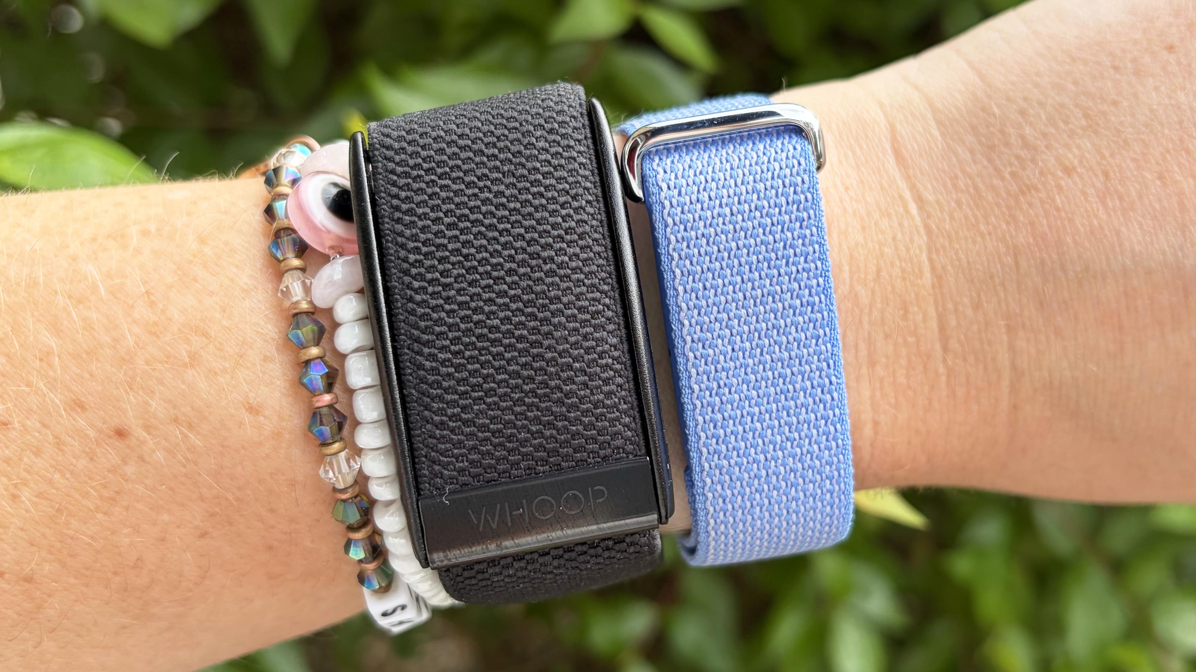 a photo of the Whoop MG and Fitbit Air 