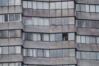 Picture of 2 men in block of flats called Lockdown Life