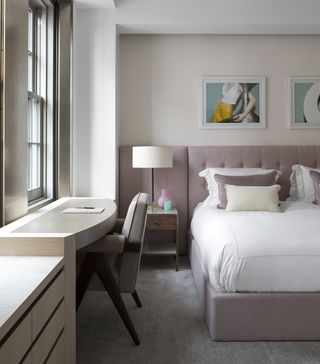 modern bedroom with lavender fabric headboard