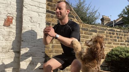 James Frew doing a HIIT workout with his dog nearby