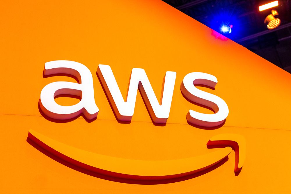 The AWS logo over an orange board 