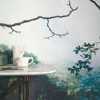 nature scenery painted wall white table white pot and cup