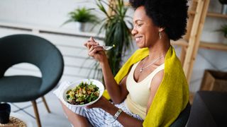Woman tucks into a healthy meal during the day