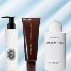 A woman with an off-the-shoulder top next top three bottles of lotion. They are all in front of a swatch of lotion background.