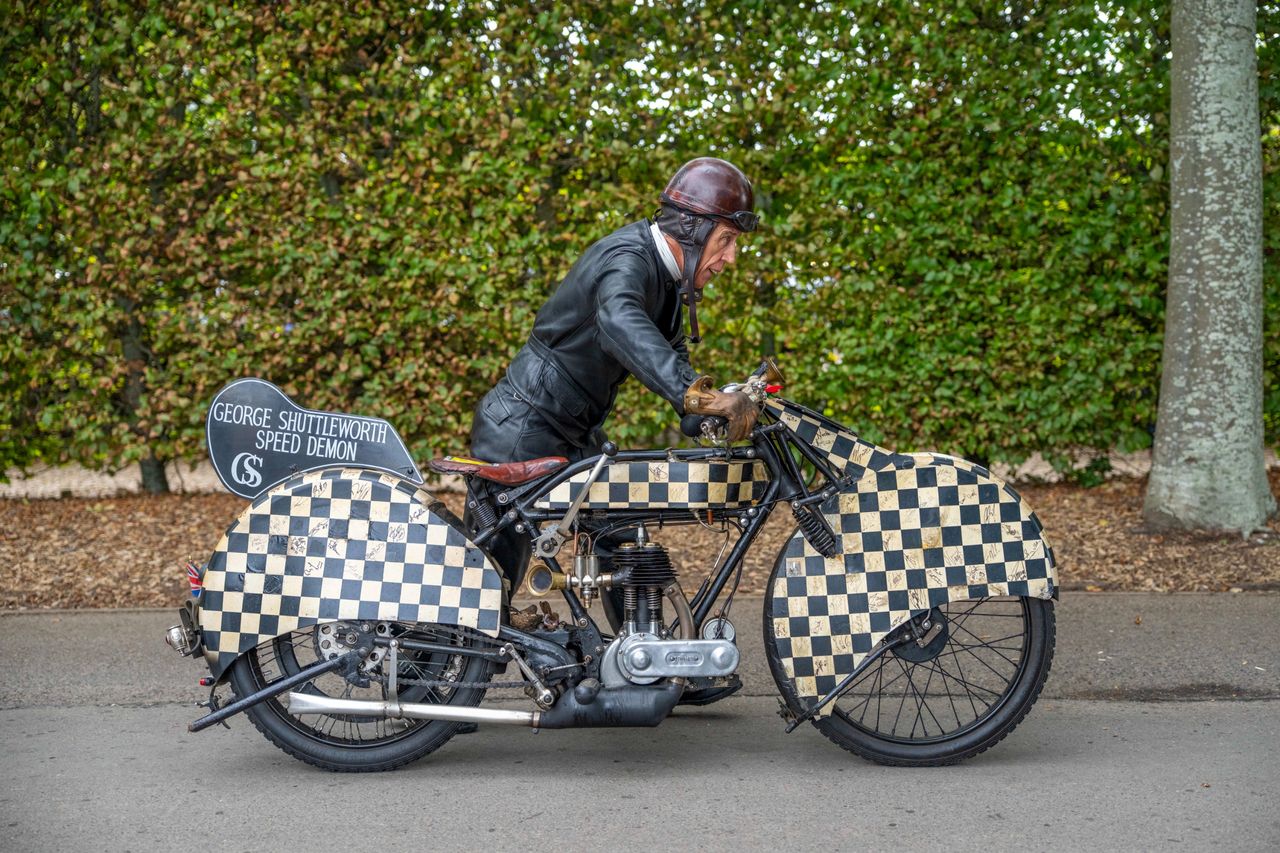 Images from the Revival. Fast cars, people in vintage dress, everyone having a nice time.
