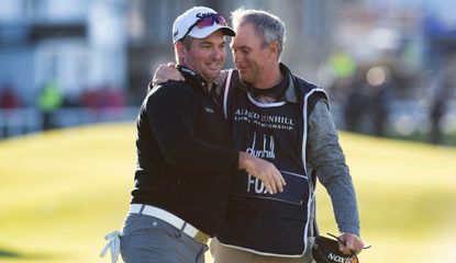 Fox celebrates with his caddie at the Old Course