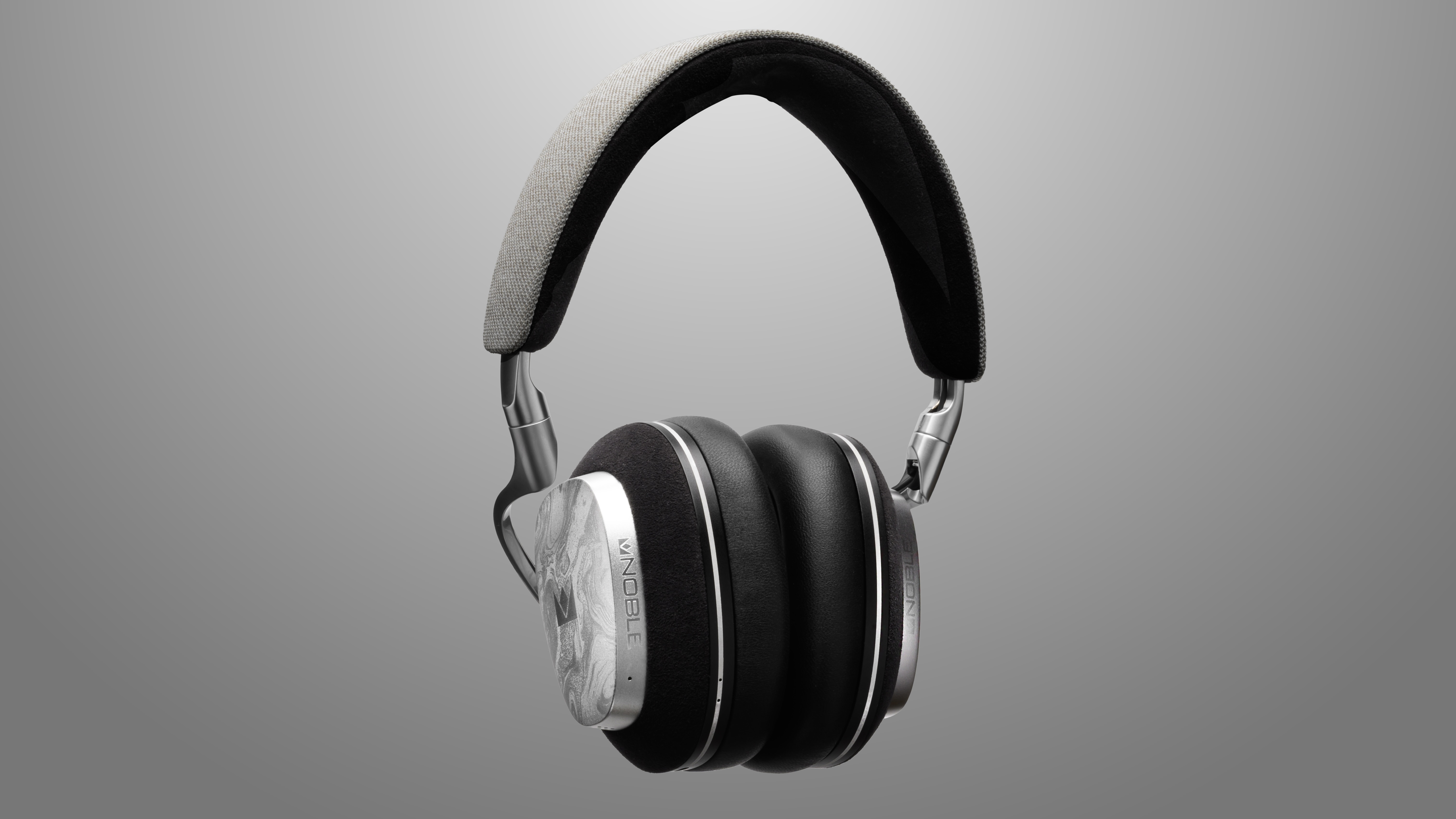 Noble Audio over-ear headphones on grey background