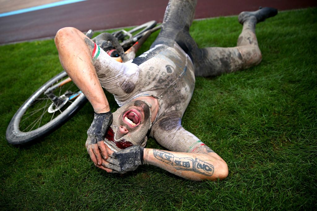 ROUBAIX FRANCE OCTOBER 03 Sonny Colbrelli of Italy and Team Bahrain Victorious covered in mud celebrates winning in the Roubaix Velodrome Vlodrome Andr Ptrieux after the 118th ParisRoubaix 2021 Mens Eilte a 2577km race from Compigne to Roubaix ParisRoubaix on October 03 2021 in Roubaix France Photo by Etienne Garnier PoolGetty Images