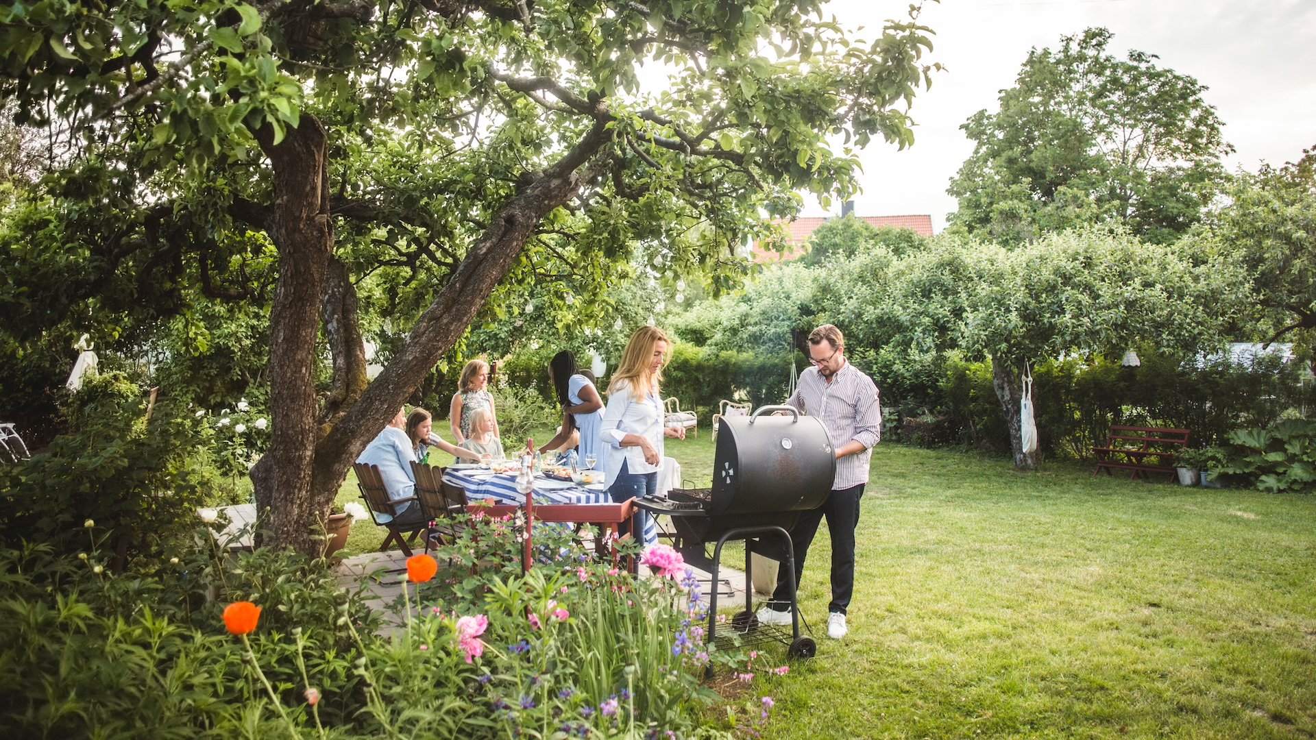 People enjoying an outdoor barbecue