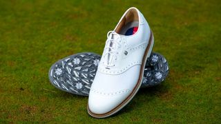 FootJoy Premiere Series Wilcox Golf Shoe resting on the golf course