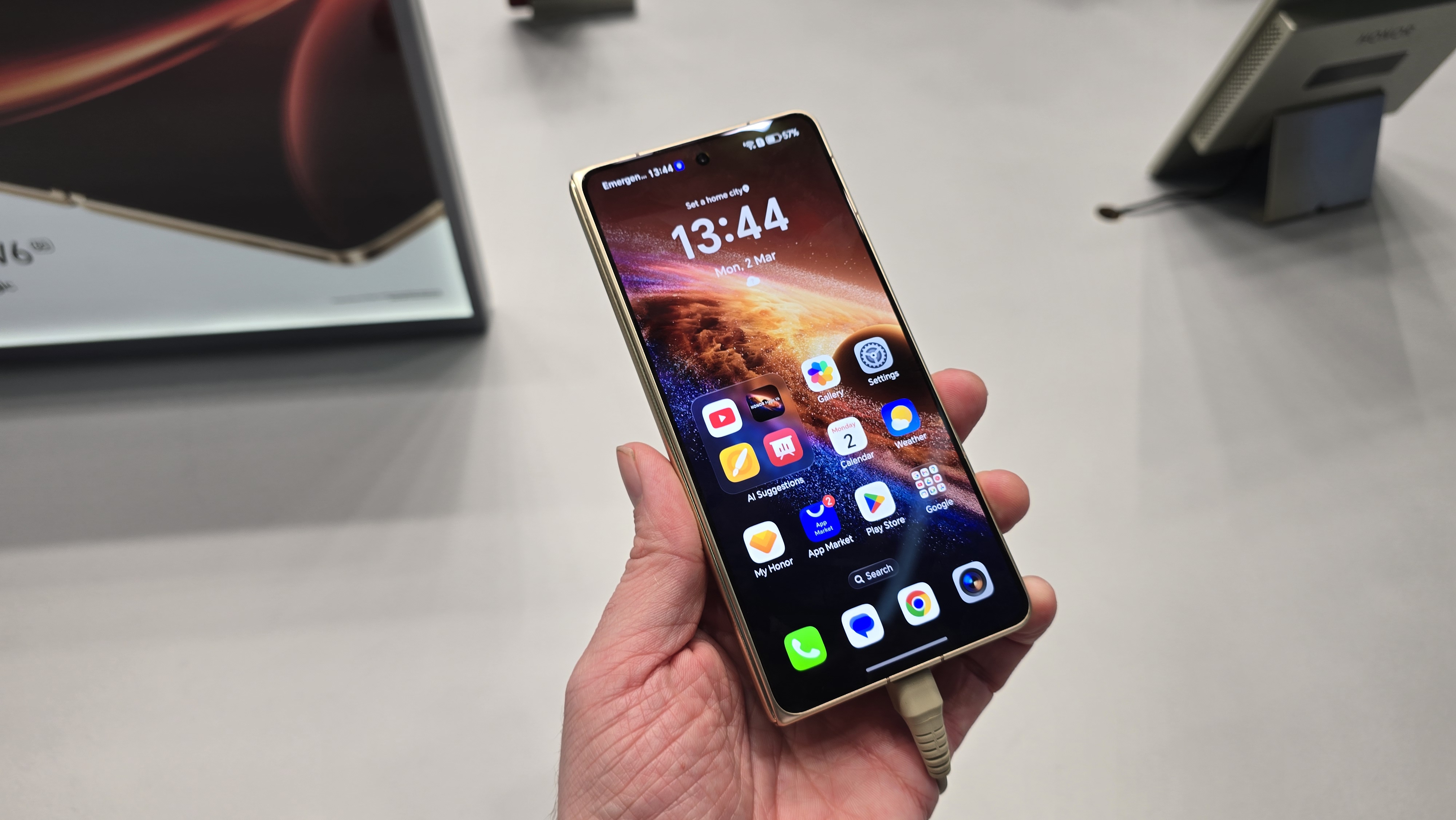 The Honor Magic V6 smartphone in a man's hand