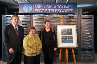 A huge astronomy archive located at the Space Telescope Science Institute (STScI) in Baltimore, Md. has been named the Barbara A. Mikulski Archive for Space Telescopes (MAST), in honor of the United States Senator from Maryland. In this picture, Senator Mikulski (D-Md.) is in the center, with STScI Director Matt Mountain at her right, and STScI deputy director Kathryn Flanagan at her left.