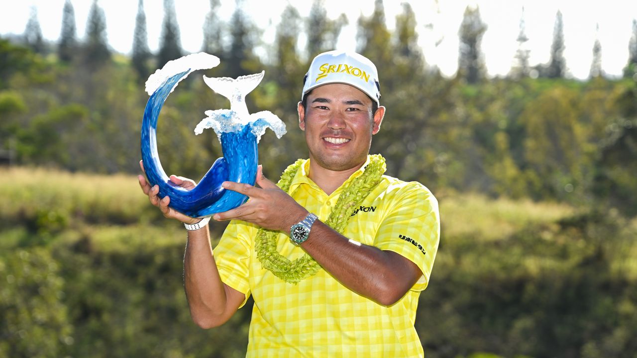 Hideki Matsuyama poses with The Sentry trophy after winning at Kapalua Resort&#039;s Plantation Course in 2025