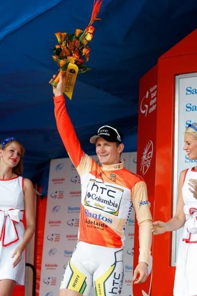 Andre Greipel (HTC-Columbia) saluters the crowd in his ocre leaders jersey.