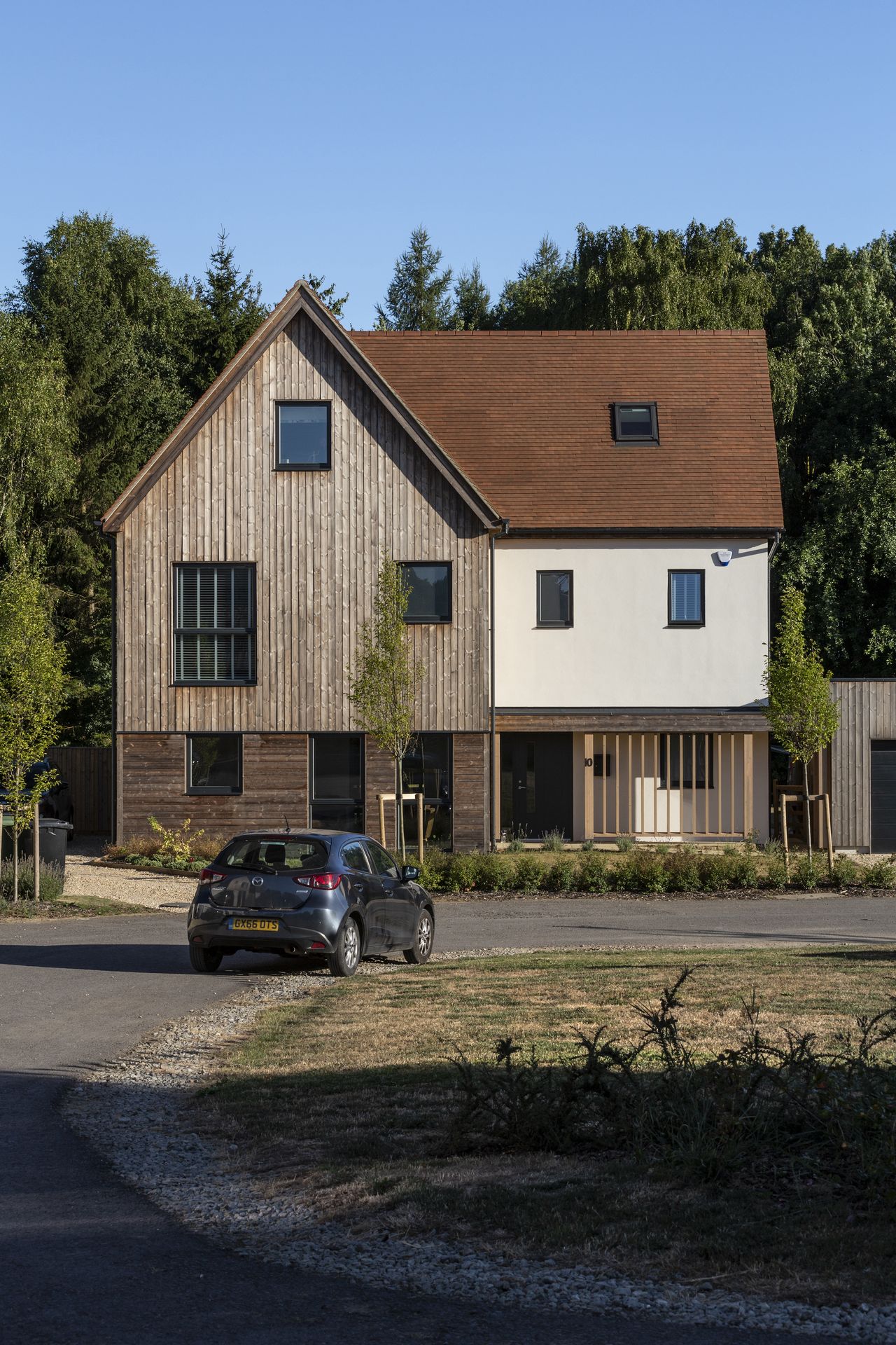 timber clad self build with driveway