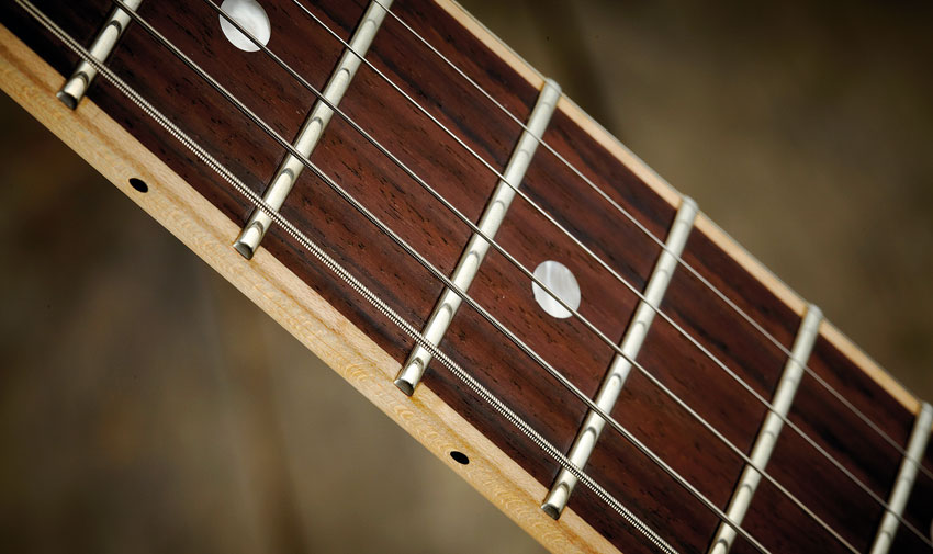 This new and seemingly unique neck construction 'inlays' the rosewood fingerboard into the maple neck. It looks smart and feels superb