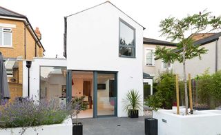 White rendered extension to semi-detached house