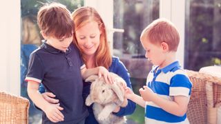 Family petting rabbit