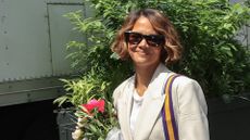 a headshot of halle berry wearing sunglasses