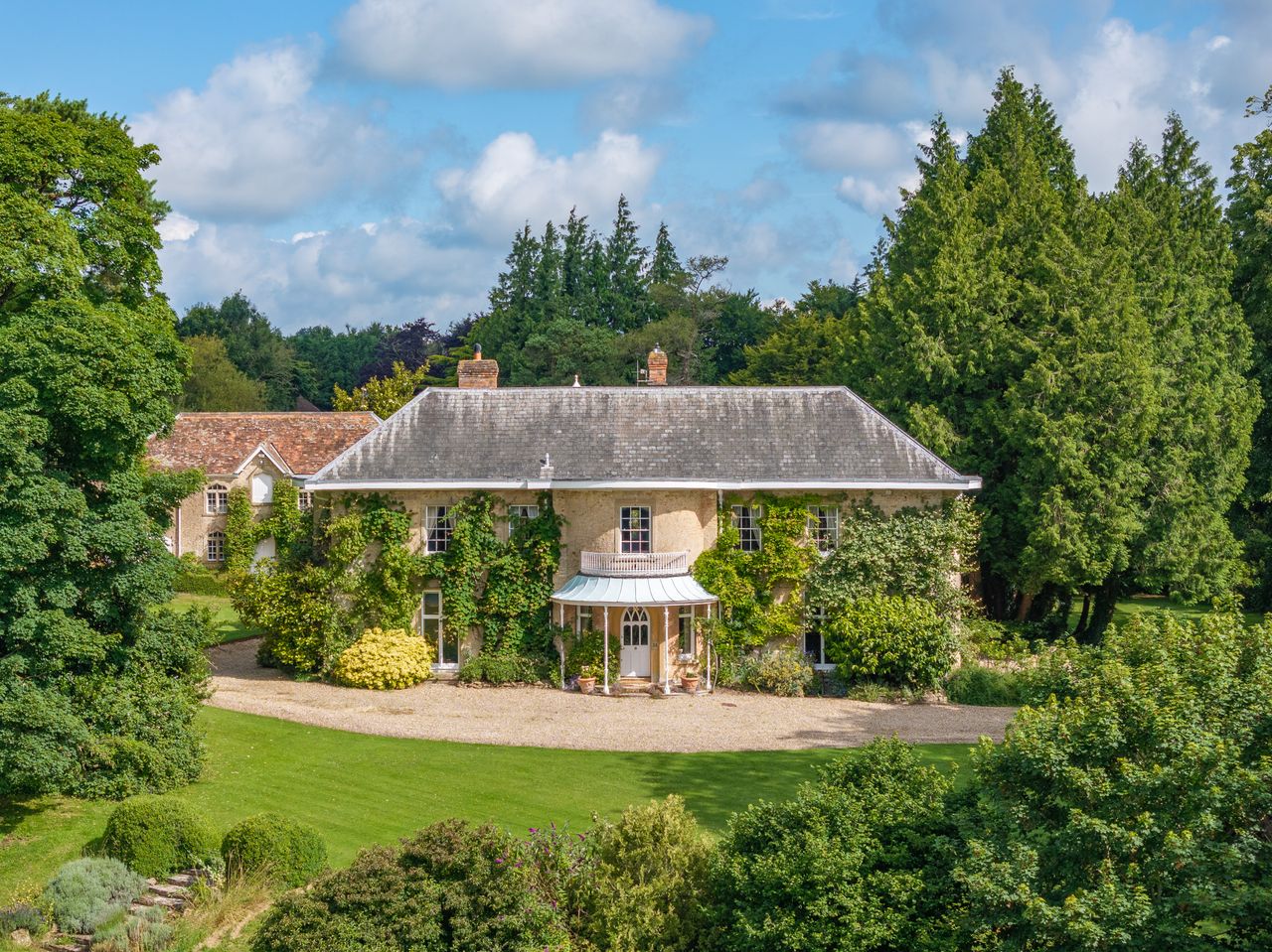A Georgian home that's the epitome of the country house dream, with four-poster beds, Aga and pool, set in one of Britain's most sought-after spots