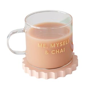 A glass mug with the phrase 