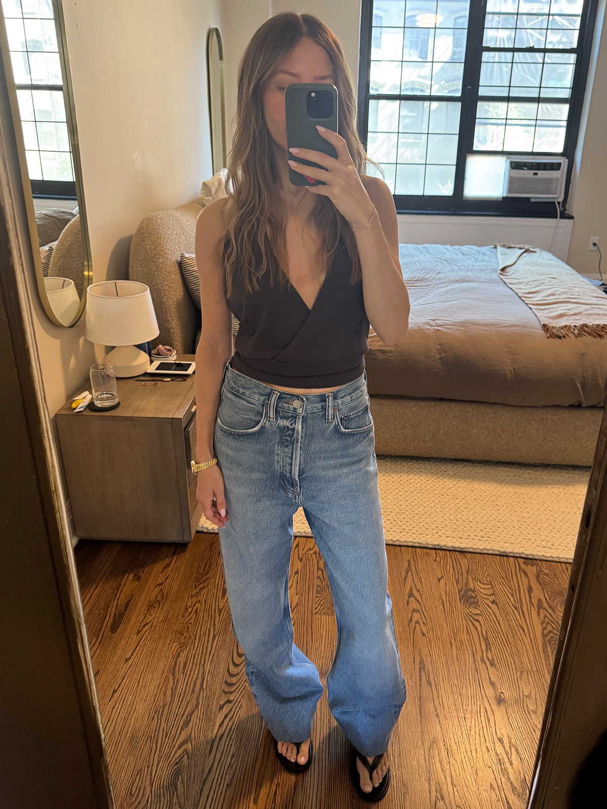 Nikki wears a halter top and Agolde loose jeans.