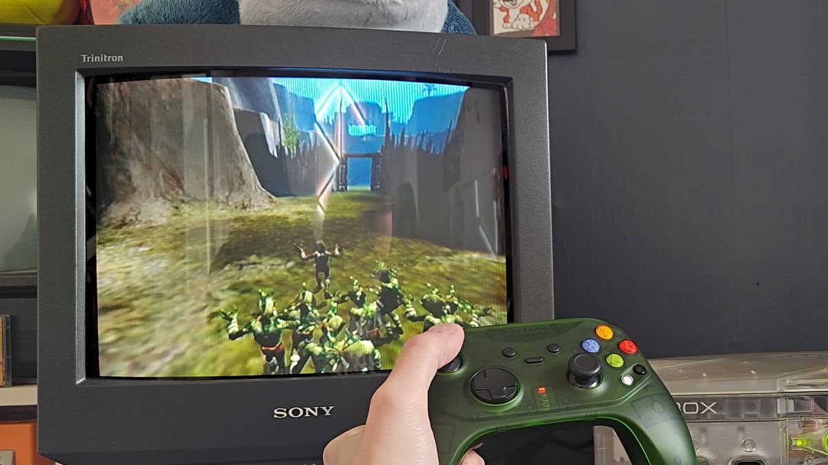 Retro Fighters Hunter controller being used to play Oddworld: Munch's Odyssey on OG Xbox with Abe and pals sneaking.