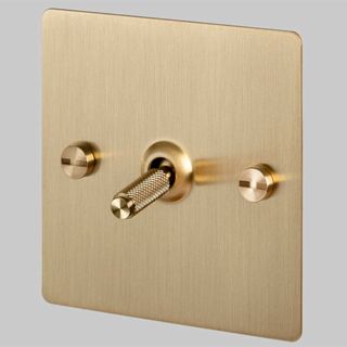 Brass light switch to show how to make a home look expensive