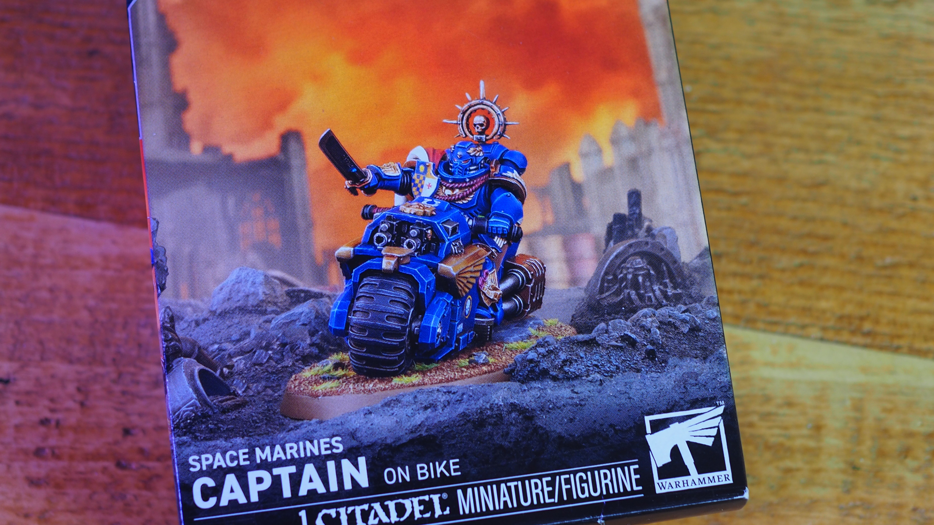 Captain on Bike box on a wooden surface