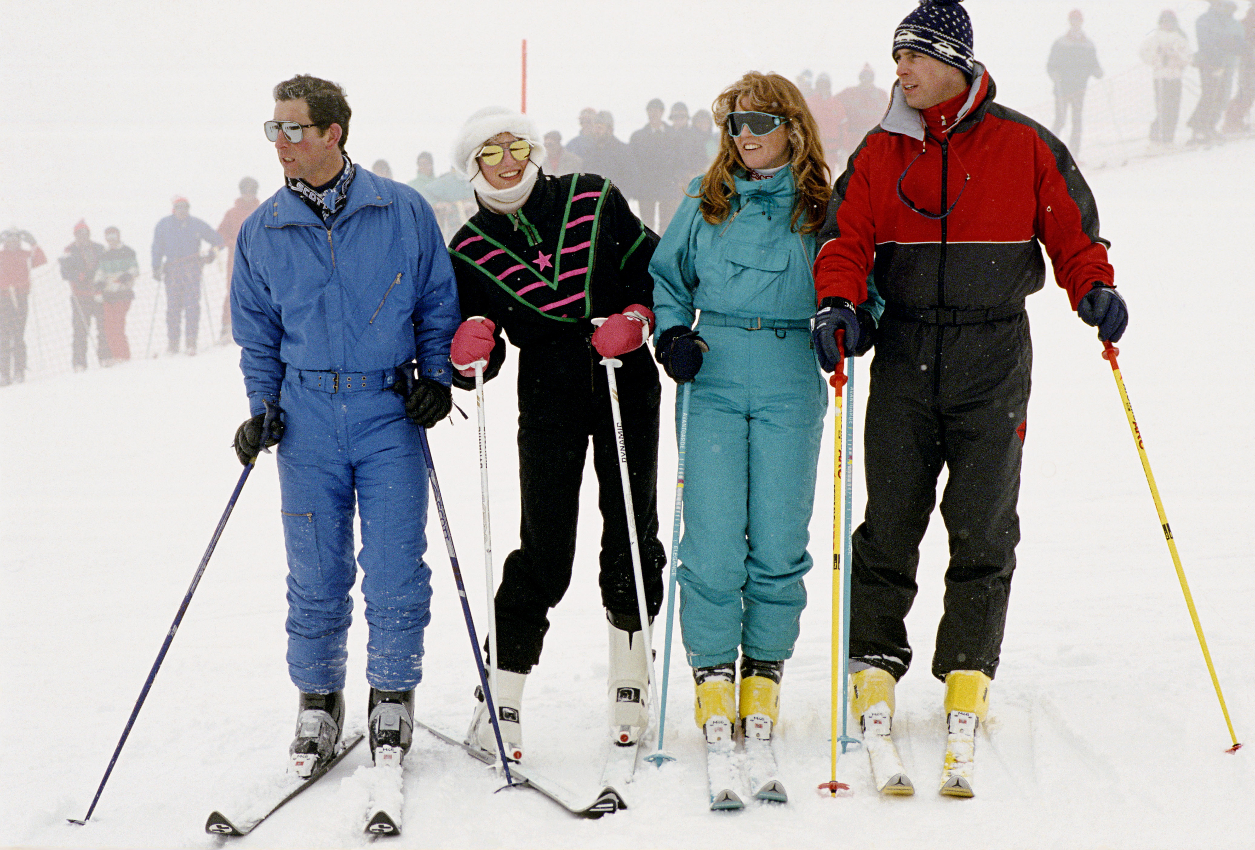 Prince Charles, Princess Diana, Sarah Ferguson and Prince Andrew standing in a row on skis