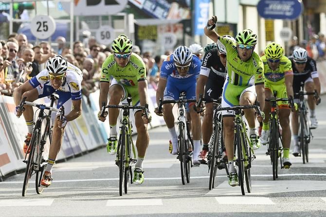 Peter Sagan (Cannondale) wins as Oscar Gatto celebrates