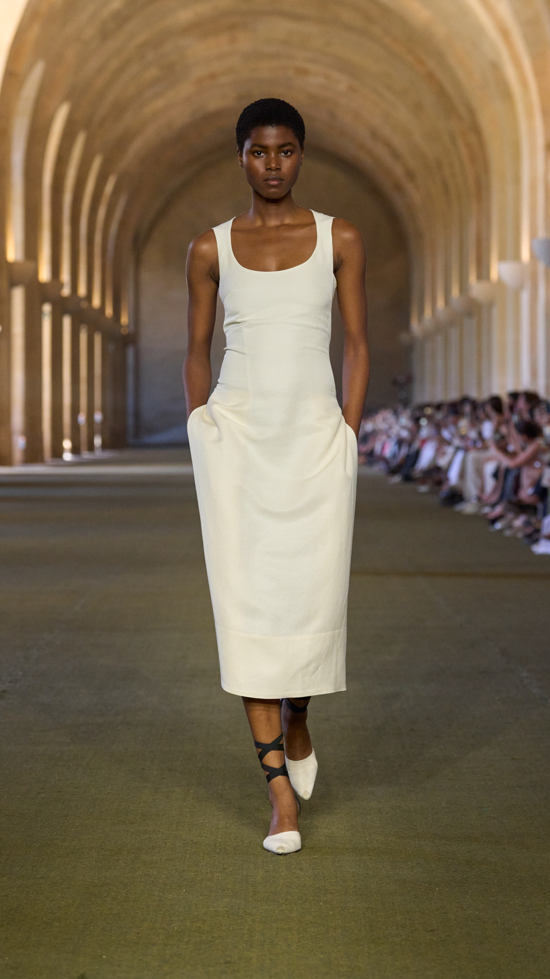 A woman walks the jacqumeus show.