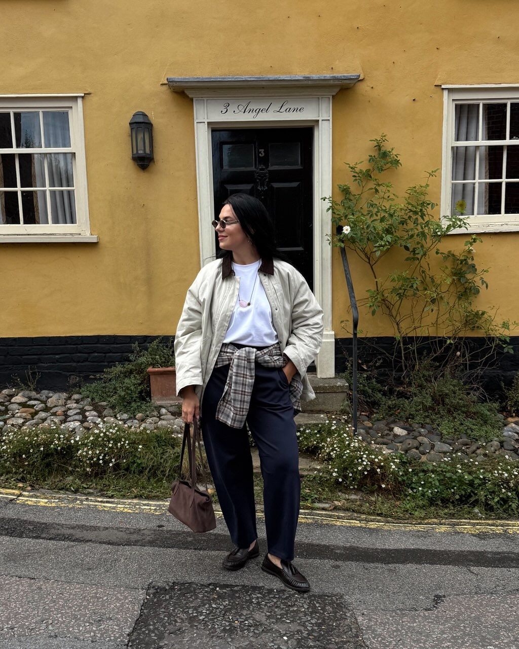 Claudia wearing navy trousers